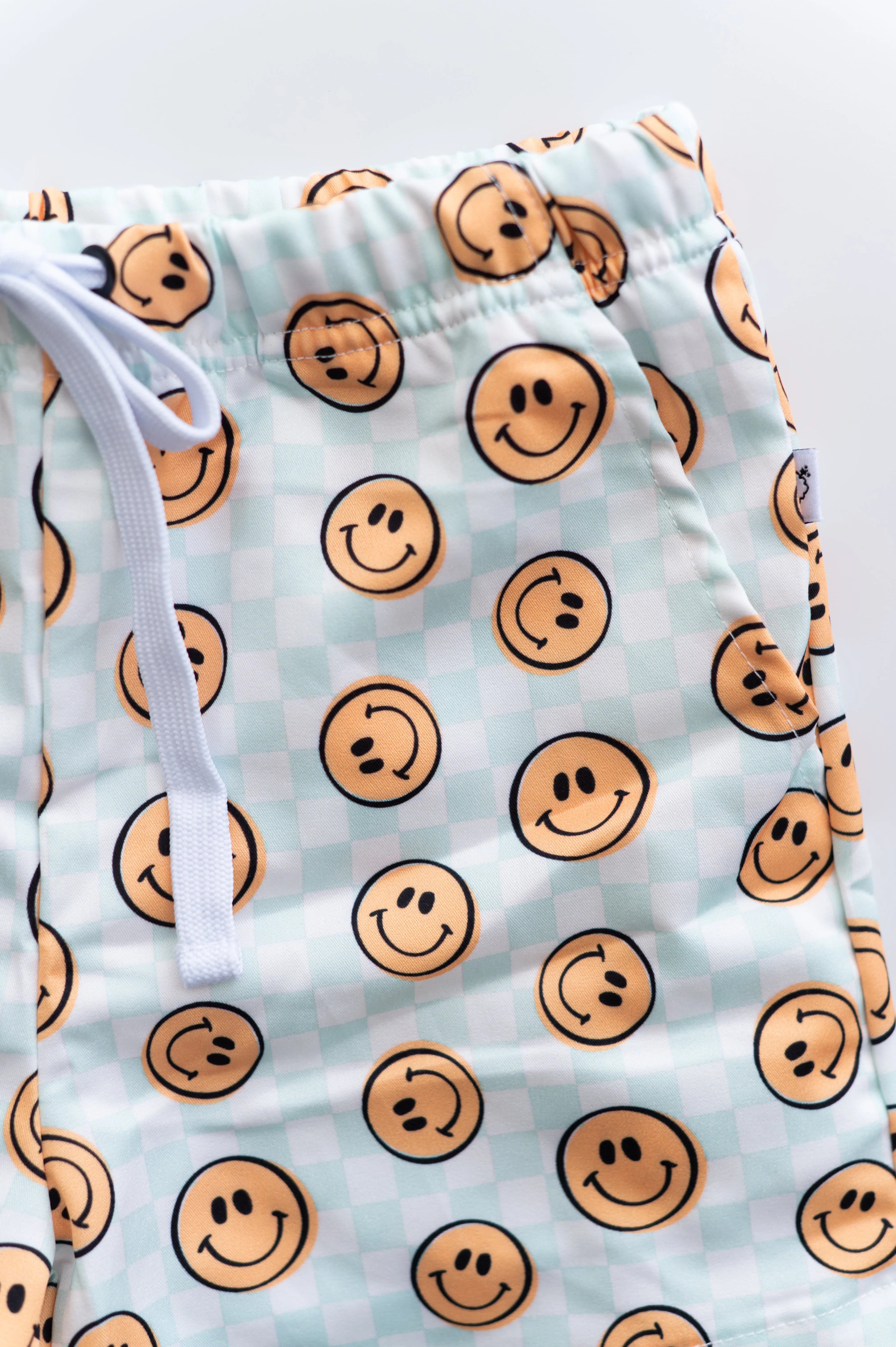 BE HAPPY CHECKERS DREAM SWIM TRUNKS
